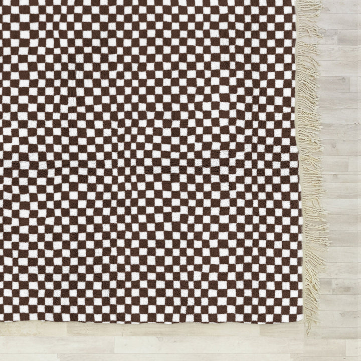 A shag Moroccan Beni Ourain Brown and White checkered rug