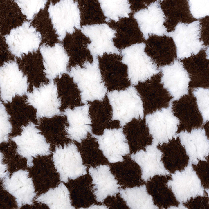 A shag Moroccan Beni Ourain Brown and White checkered rug