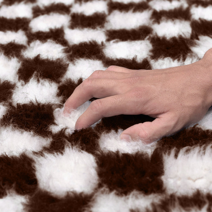 A shag Moroccan Beni Ourain Brown and White checkered rug