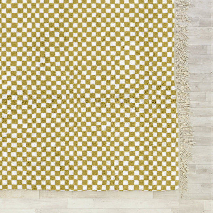 A sheepskin Beni Ourain Moroccan Yellow and White checkered rug