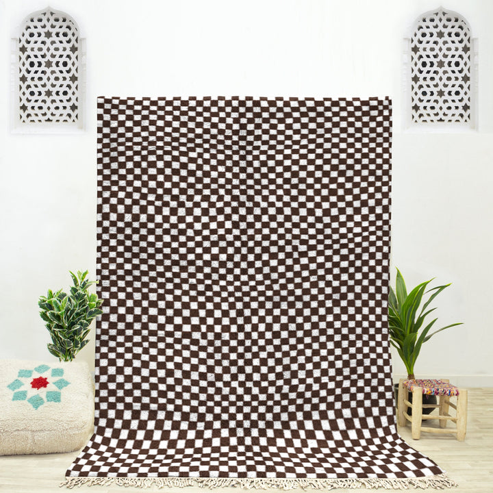 A shag Moroccan Beni Ourain Brown and White checkered rug