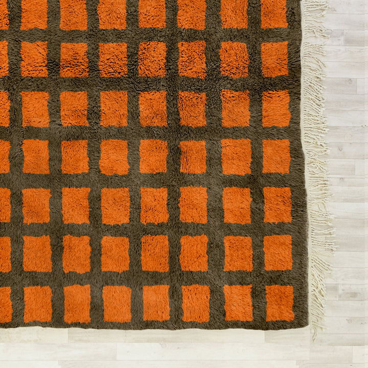 A sheepskin Moroccan Beni Ourain Orange and Grey checkered rug