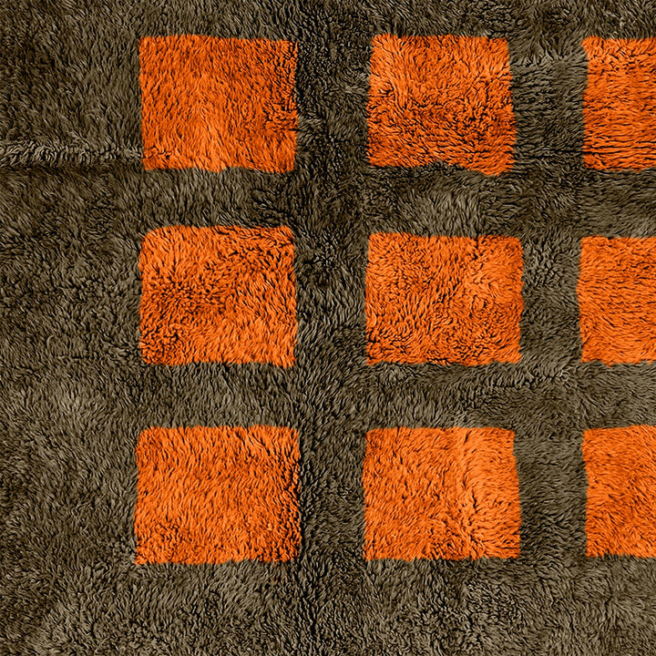 A sheepskin Moroccan Beni Ourain Orange and Grey checkered rug