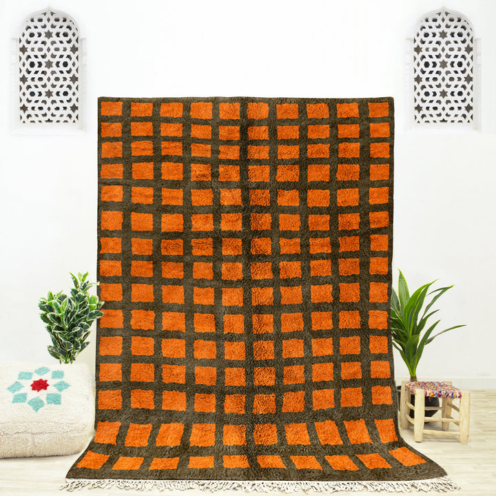 A sheepskin Moroccan Beni Ourain Orange and Grey checkered rug