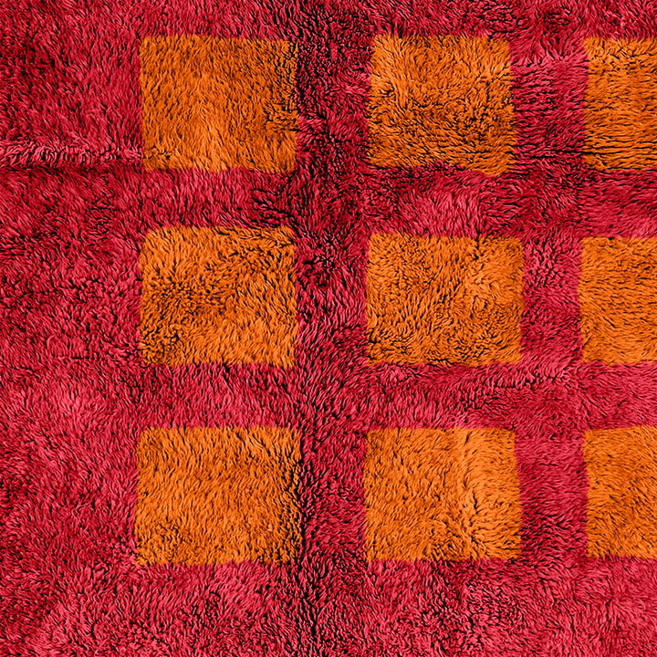 A custom handmade Orange Moroccan Berber checkerboard rug