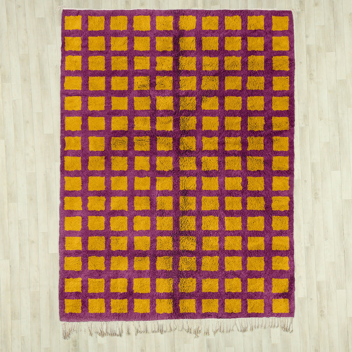 A shag Moroccan Beni Ourain Yellow and Purple checkered rug