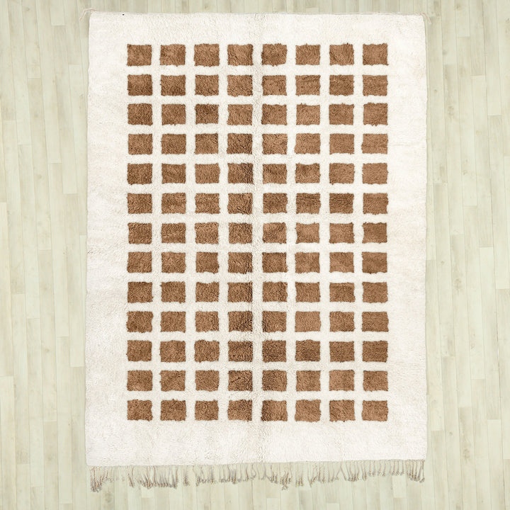 A sheepskin Beni Ourain Moroccan Brown and White checkered rug