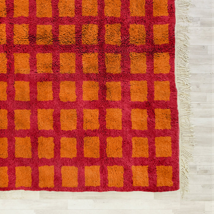 A custom handmade Orange Moroccan Berber checkerboard rug