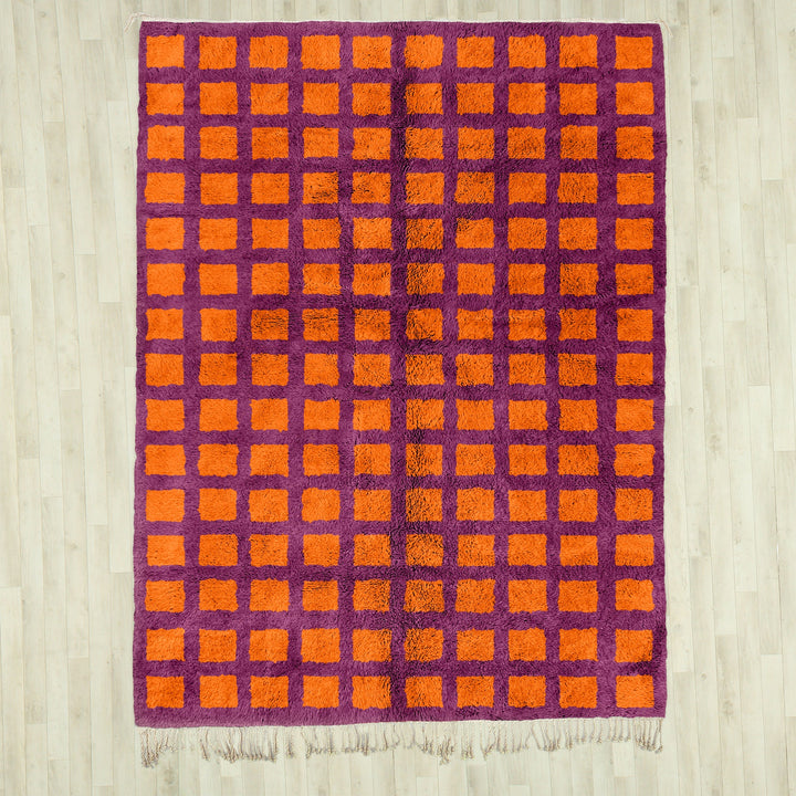 A custom Orange Bohemian Moroccan Beni Ourain checkered rug