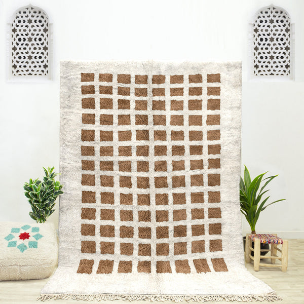 A sheepskin Beni Ourain Moroccan Brown and White checkered rug