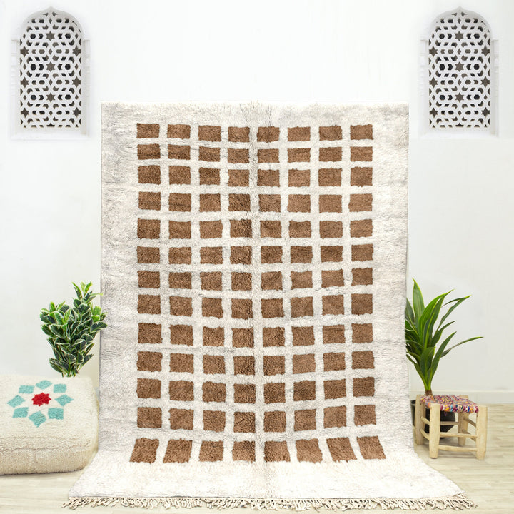 A sheepskin Beni Ourain Moroccan Brown and White checkered rug